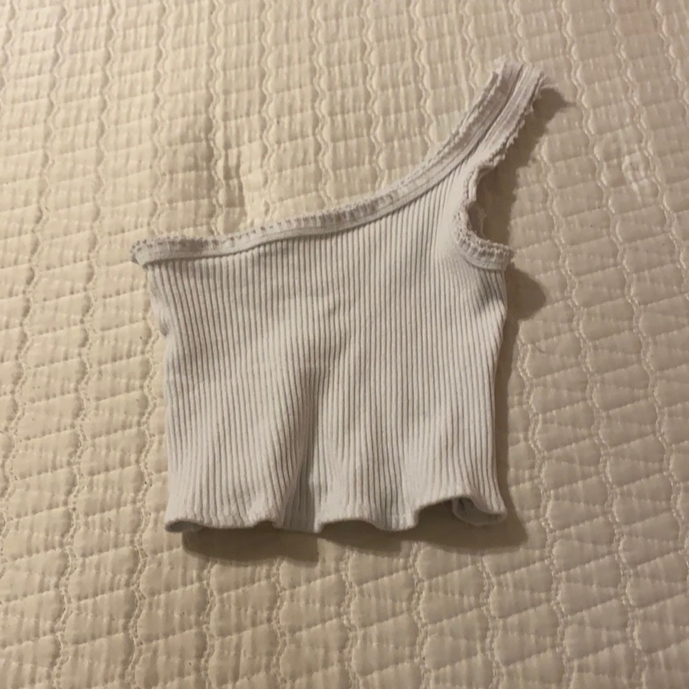 A white Urban Outfitters one shouldered top.